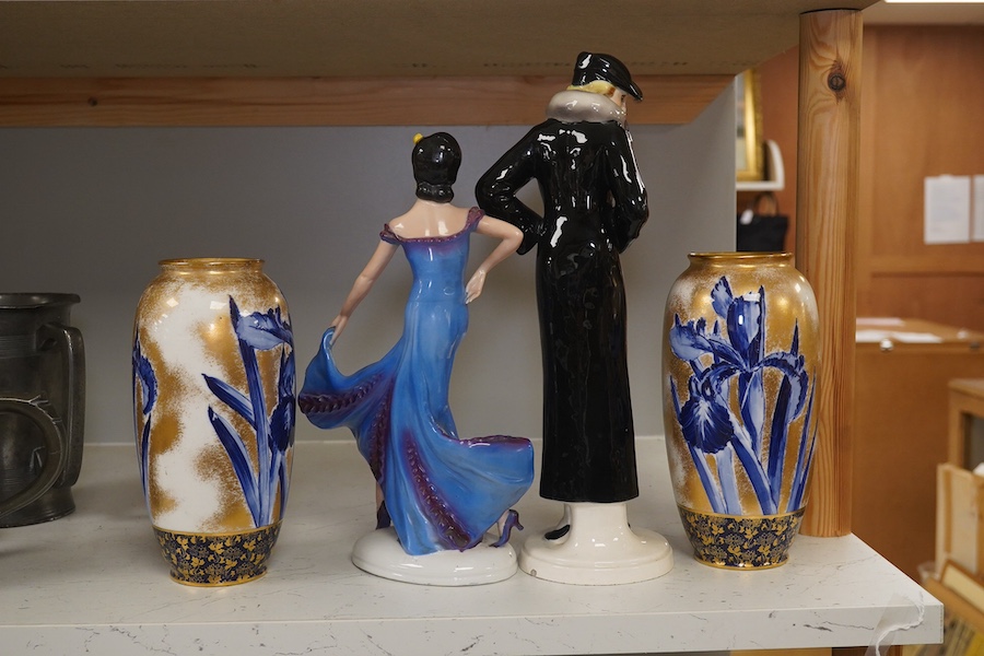 A pair of Royal Doulton vases decorated with irises and a gilt background, 19cm high, and two Art Deco pottery figurines, one marked foreign, tallest 32cm. Condition - fair to good.